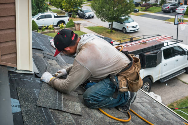 Professional Roofing technician working in Houghton, MI